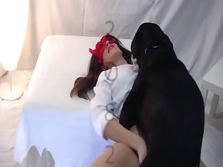 Babe in a red mask likes her doggy's tongue so much